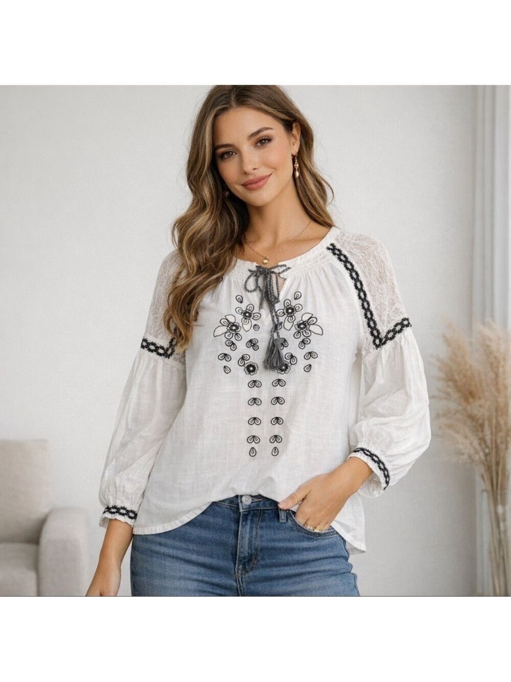 White blouse with black embroidered flowers